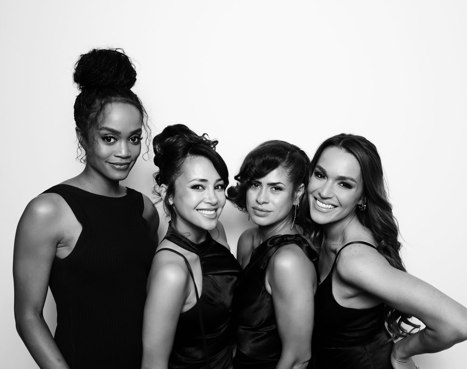 Friends striking a pose in the glam booth